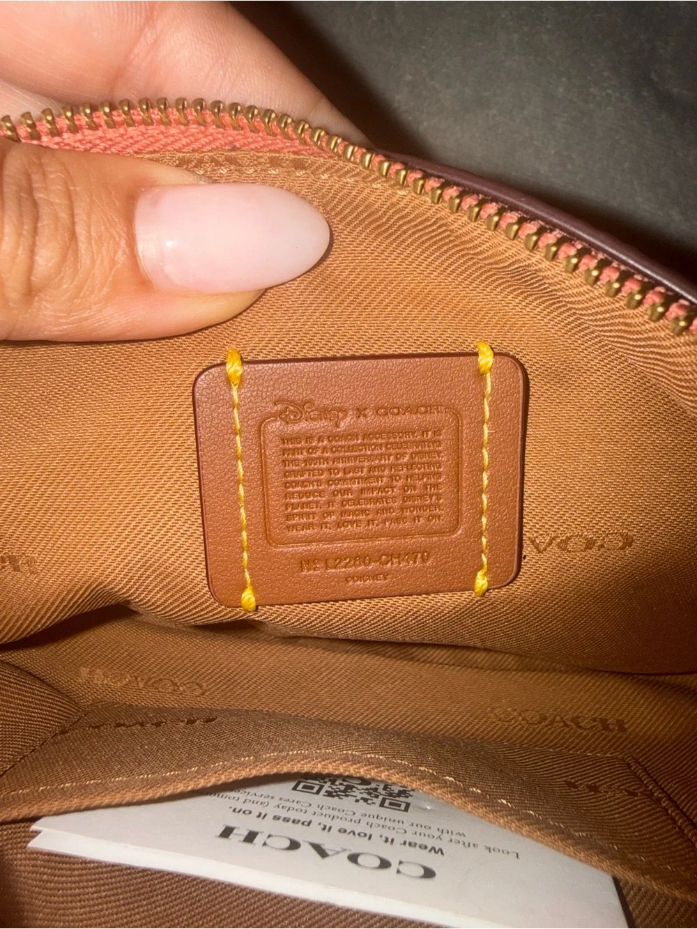 COACH x DISNEY Daisy Leather Wristlet Pouch in Coral Pink
